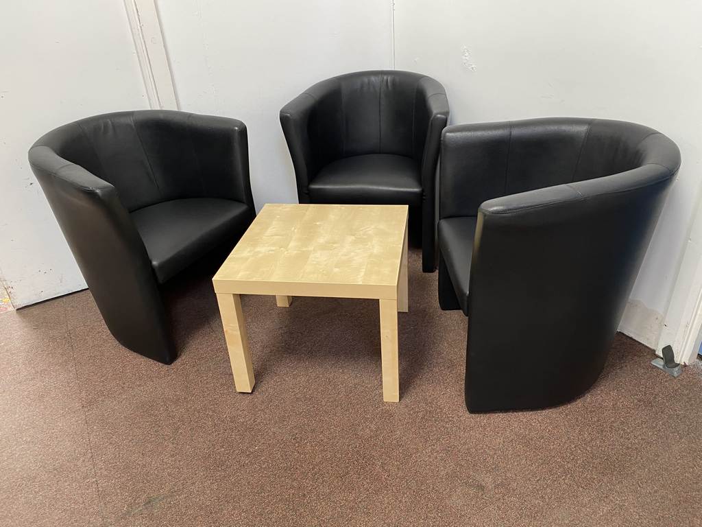 used black faux leather tub chairs